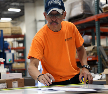 An EleMech employee in the workshop.